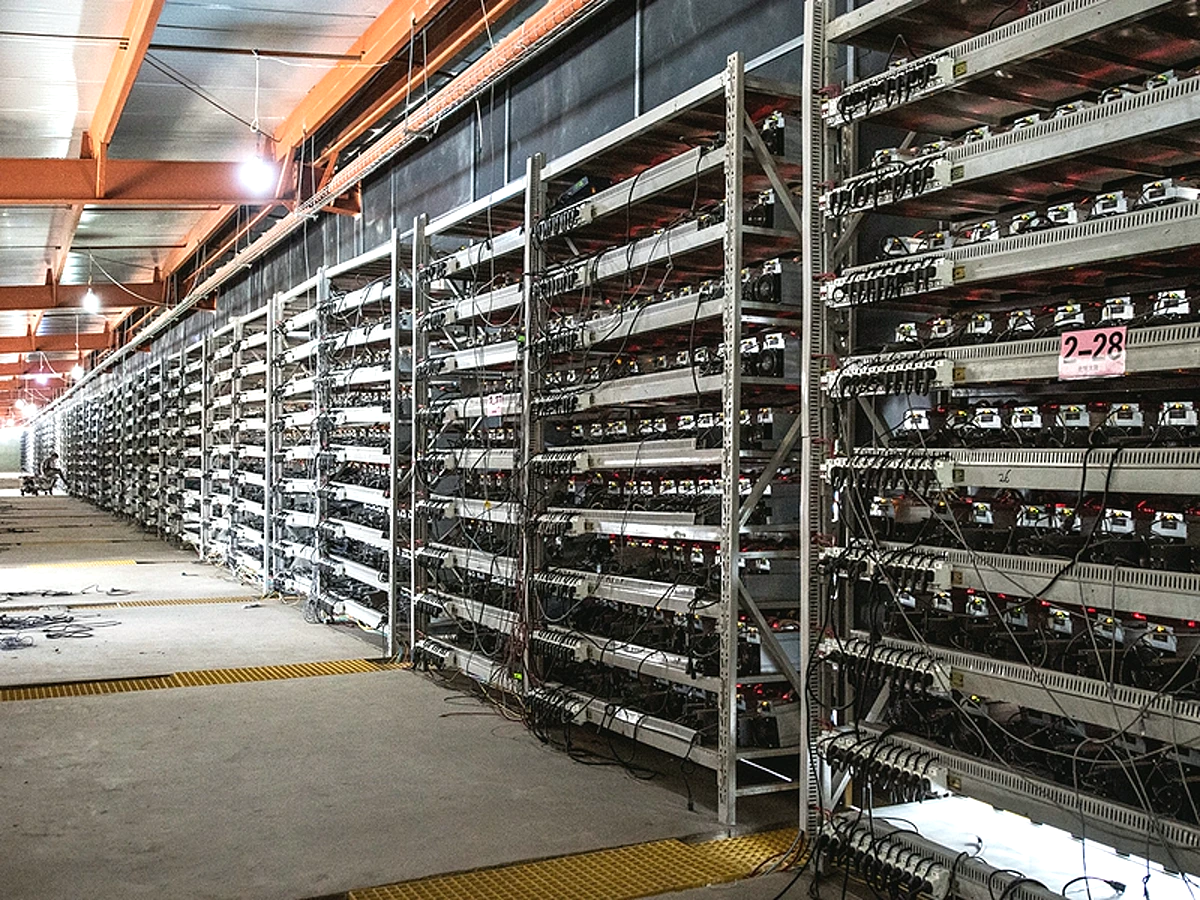 Wide-angle mining equipment rack aisle reference image for AC4